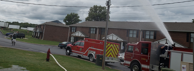 A firetruck spraying water.