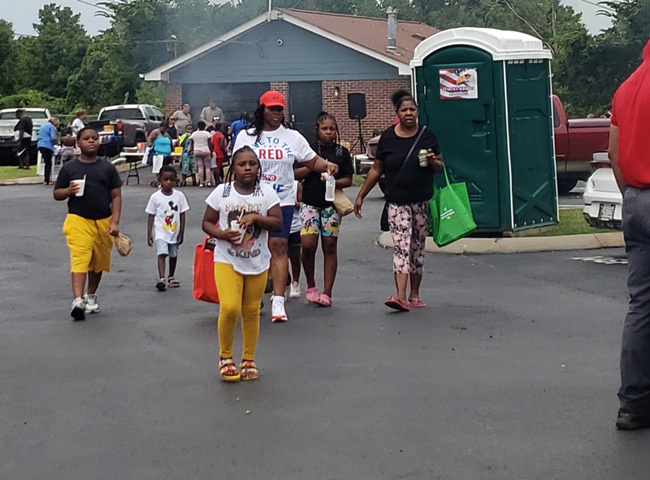 A group of individuals walking down a street.