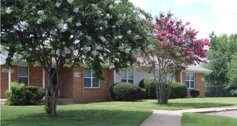 A sidewalk leads up to the Center Pointe Apartments.