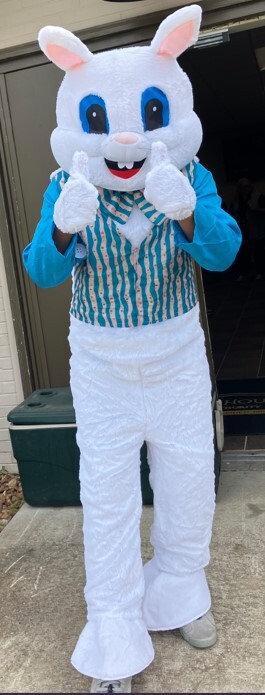 A person in a bunny costume giving two thumbs up.