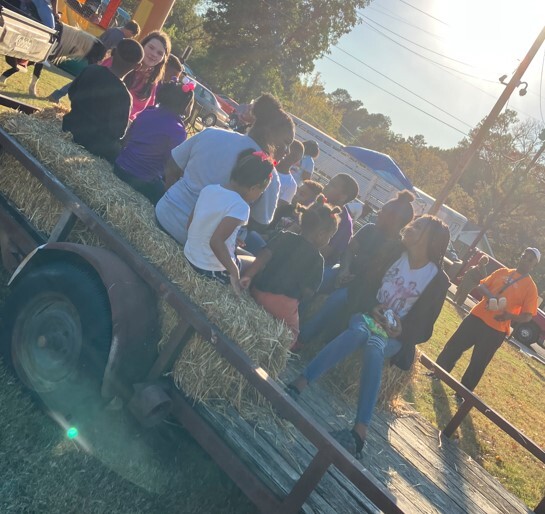 People getting ready for a hay ride.