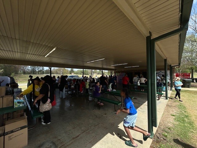 Covered people standing and talking with each other. 