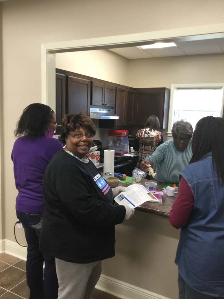 FESMM attendees gathering ingredients in kitchen