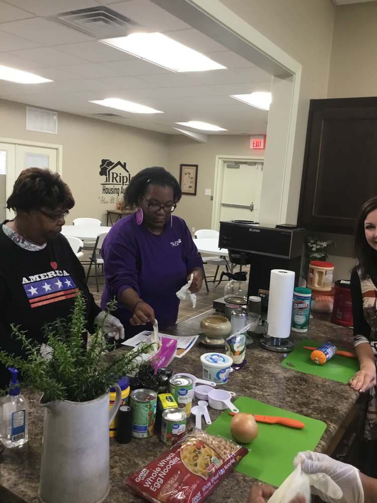 FESMM residents putting on gloves to start cooking